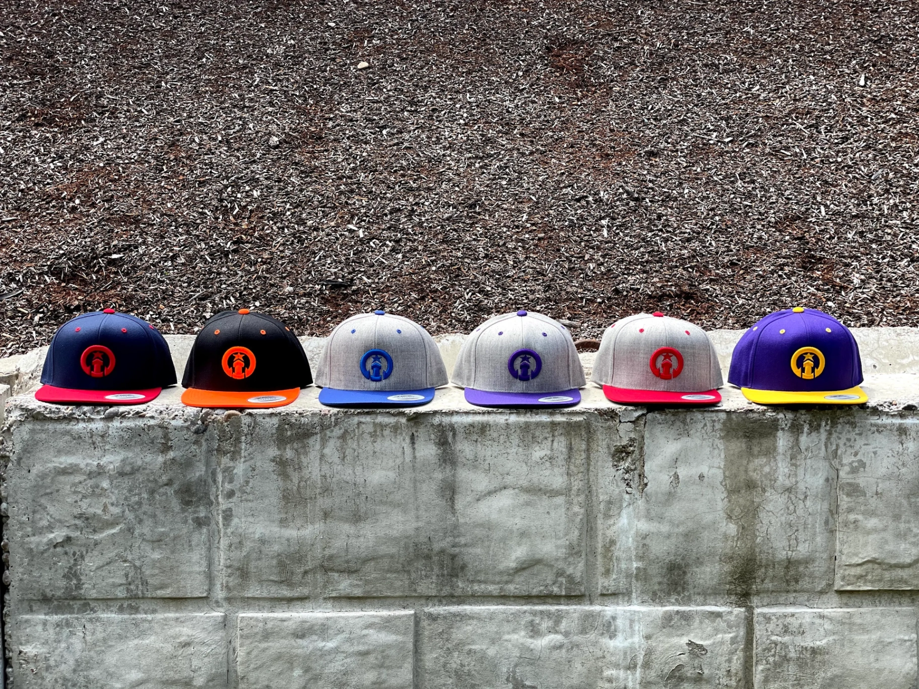 Custom embroidered snapback hat run in six colorways