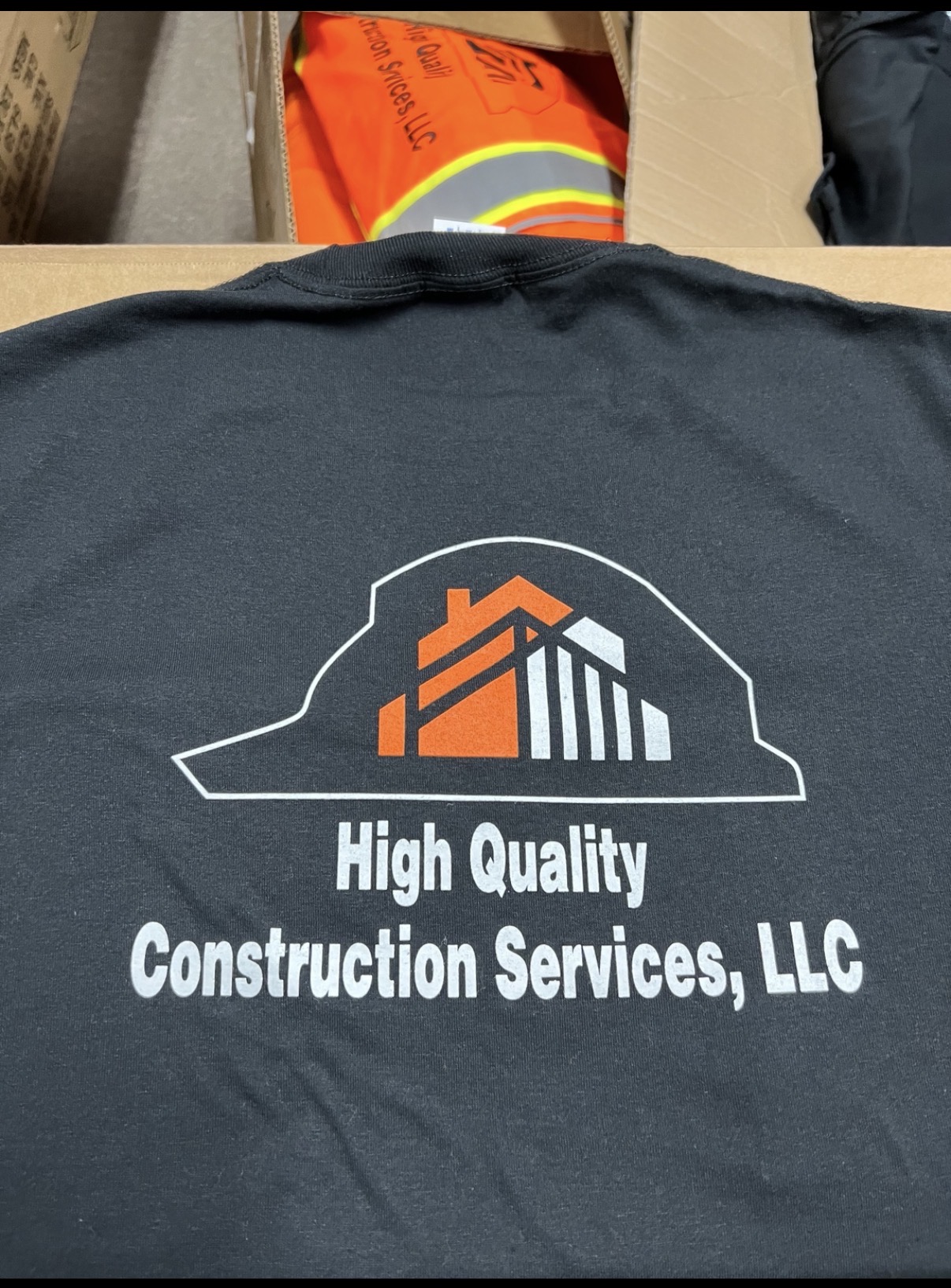 High Quality Construction Services shirts folded and ready for delivery