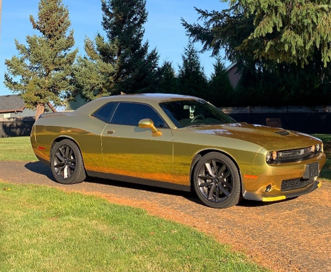 Dodge Challenger wrapped in gold chrome color-shift vinyl